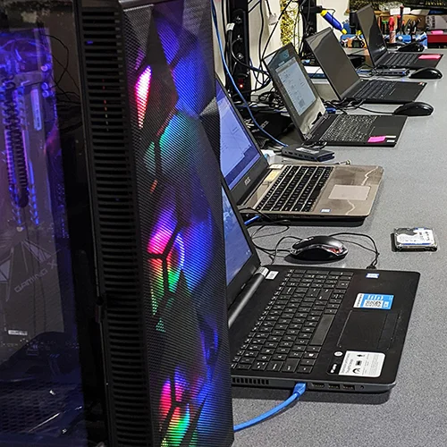 a row of laptops on a workbench getting repaired, which laptop is best